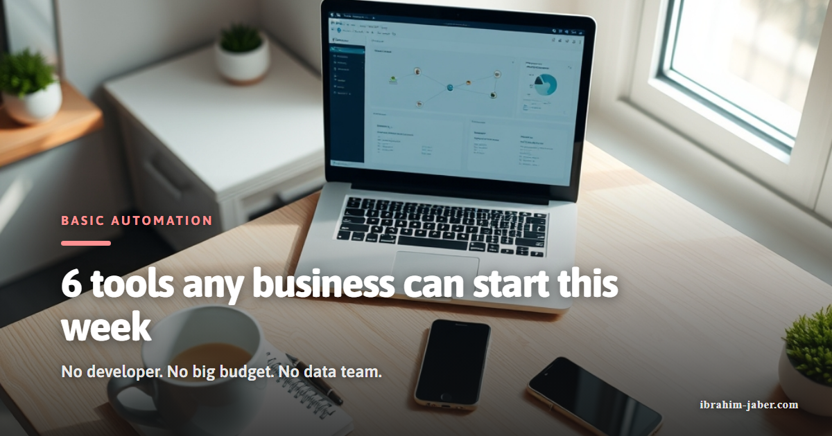 Small business workspace with a laptop showing an automation workflow dashboard